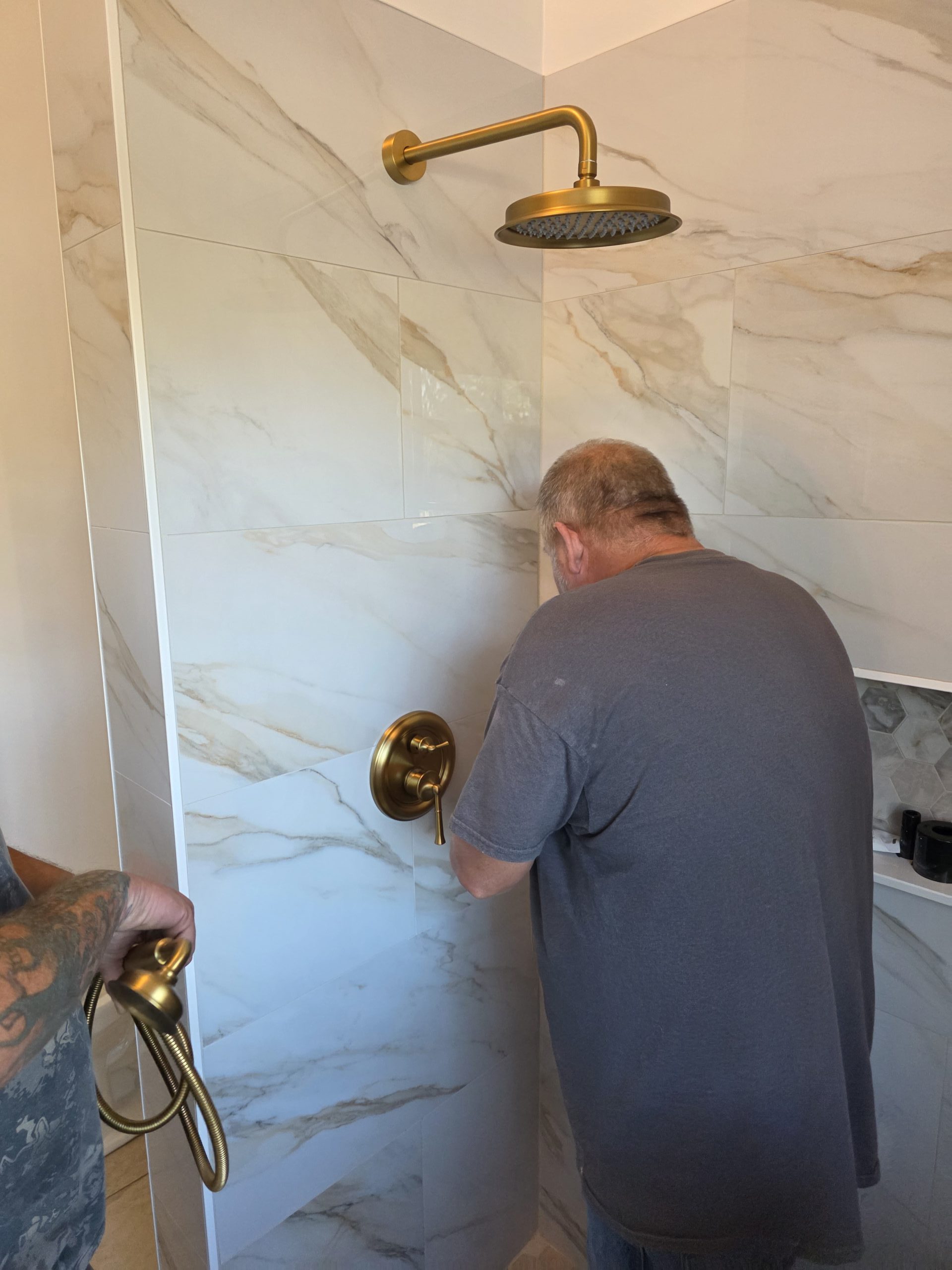 worker installing a new shower